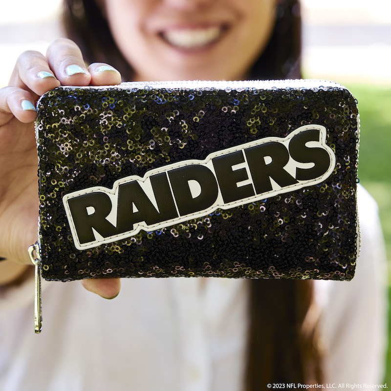 Image of woman holding out the Las Vegas Raiders Sequin Wallet to the camera 
